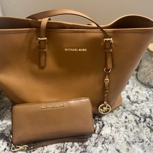 Zip around large wallet and large MK tote.